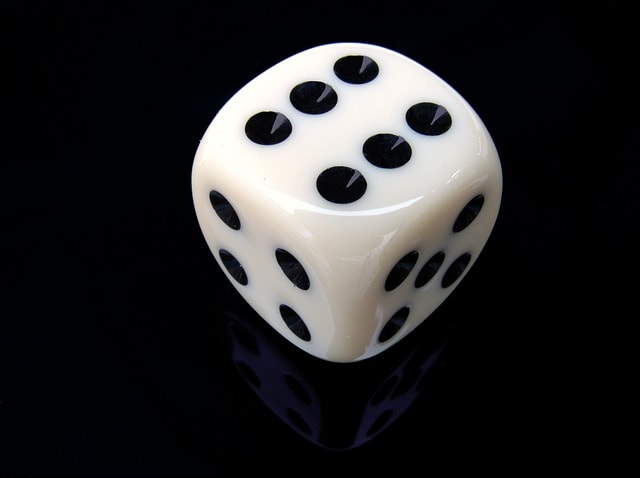 A die (cube) with the numbers 1 to 6 printed on the sides.